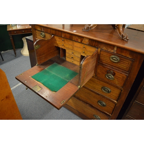 230 - A George III mahogany chest of drawers with secretaire central drawer (faults).