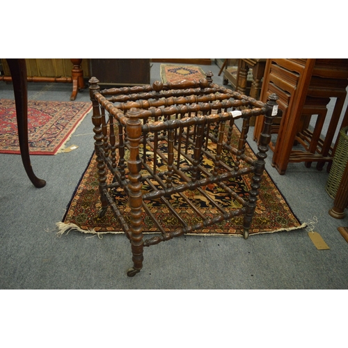 247 - A Victorian rosewood bobbin turned magazine rack.