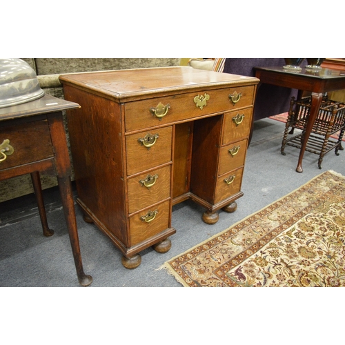 248 - A good 18th century oak kneehole desk.