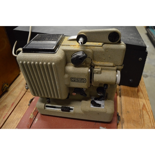 An old projector, record player, records, gramophone etc.