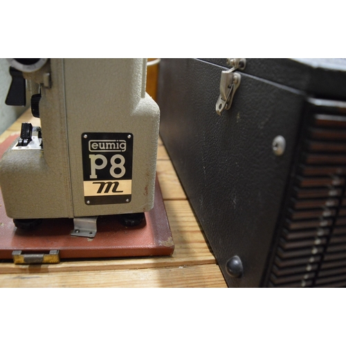 An old projector, record player, records, gramophone etc.