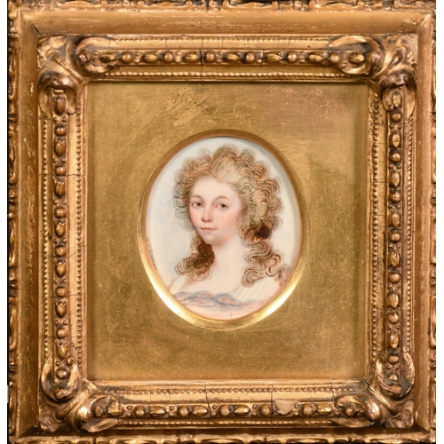 50 - H. M. Horner..?, a miniature portrait of a lady, watercolour and bodycolour on ivory, signed, 2.25