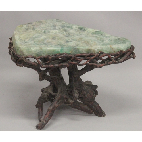 1009 - A SUPERB MARBLE TOP TABLE with rustic  base. 2ft 4ins long, 1ft 10ins wide at the longest point. 1ft... 