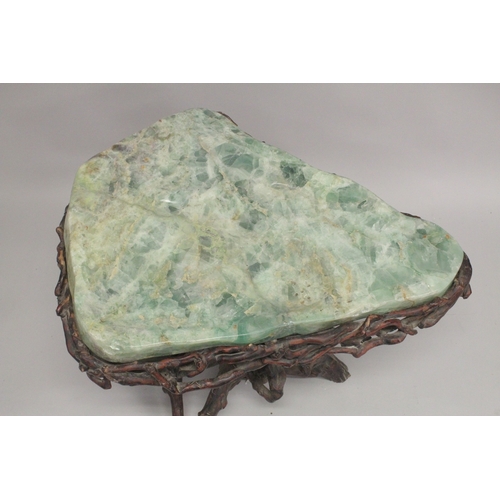 1009 - A SUPERB MARBLE TOP TABLE with rustic  base. 2ft 4ins long, 1ft 10ins wide at the longest point. 1ft... 