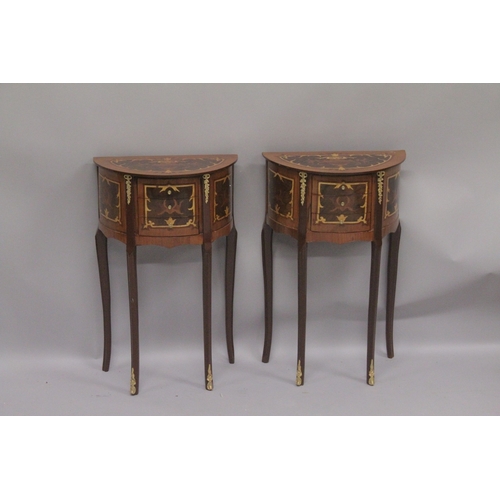 1012 - A PAIR OF LOUIS XVI DESIGN INLAID HALF MOON BEDSIDE TABLES with three drawers on curving legs. 2ft 4... 