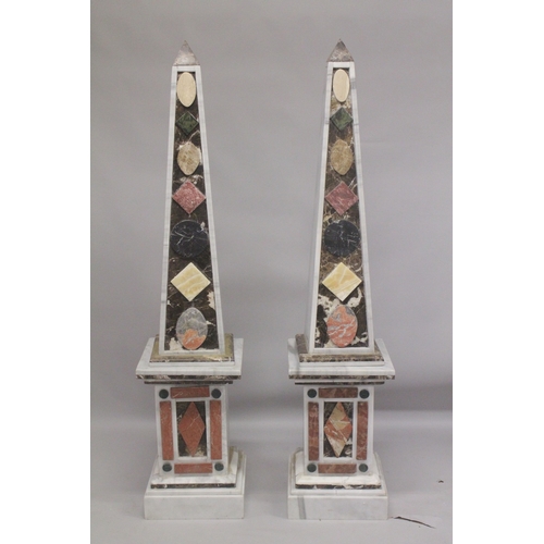 1019 - A GOOD PAIR OF COLOURED MARBLE OBELISKS ON STANDS. 6ft high.