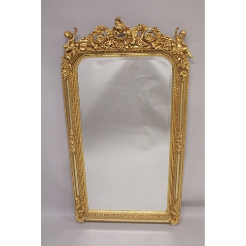 1020 - A GOOD GILTWOOD MIRROR with cupids and acanthus. 5ft high x 2ft 7ins wide.