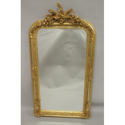 1021 - A GOOD GILTWOOD MIRROR with birds and flowers. 5ft high x 2ft 7ins wide.