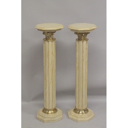 1026 - A PAIR OF BEIGE MARBLE CLUSTER COLUMNS with gilt metal mounts. 3ft 4ins high.