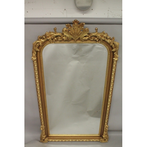 1032 - A GOOD LARGE GILT FRAMED VICTORIAN STYLE PIER MIRROR with decorative cresting. 7ft 3ins x 4ft 2ins.... 