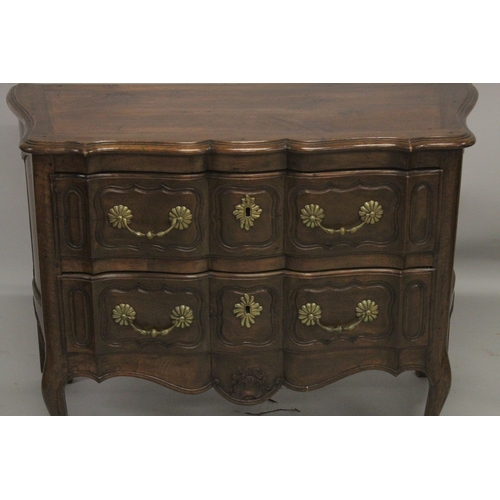 1035 - A GOOD 19TH CENTURY ITALIAN TWO DRAWER COMMODE of serpentine outline, heavy brass handles and escutc... 