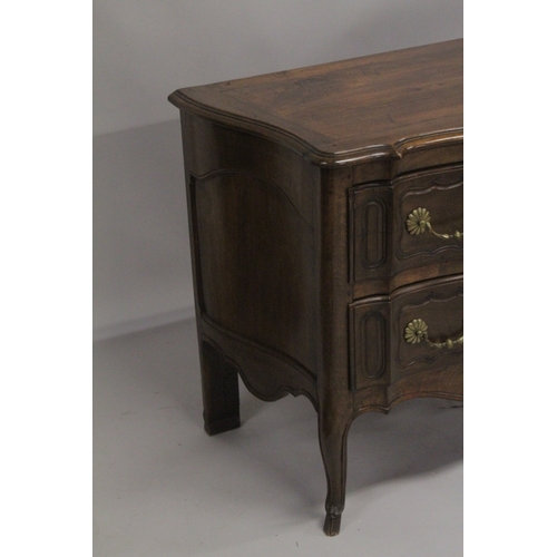 1035 - A GOOD 19TH CENTURY ITALIAN TWO DRAWER COMMODE of serpentine outline, heavy brass handles and escutc... 