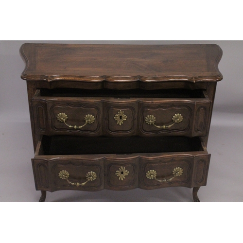 1035 - A GOOD 19TH CENTURY ITALIAN TWO DRAWER COMMODE of serpentine outline, heavy brass handles and escutc... 