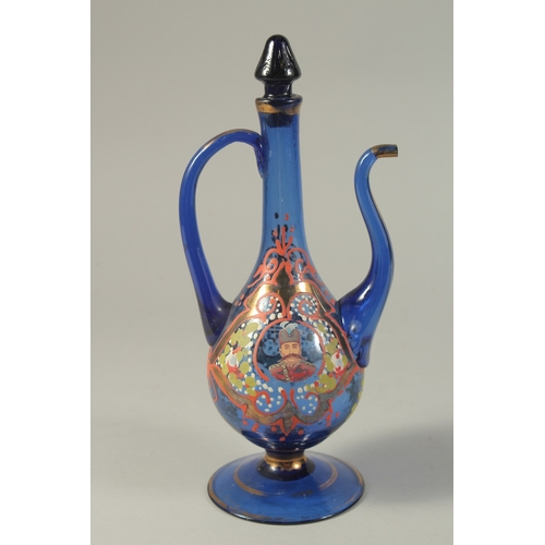 1051 - A PERSIAN BLUE GLASS JUG with reverse portraits.