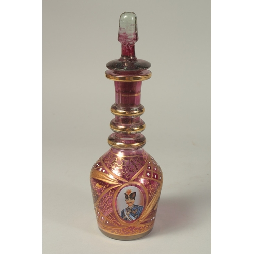 1060 - A GOOD RUSSIAN RUBY GLASS DECANTER AND STOPPER with gilt decoration and and oval portrait of a Russi... 