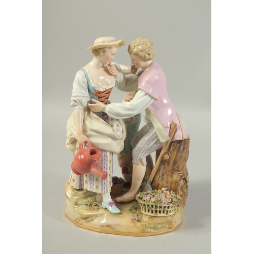 1067 - A LARGE MEISSEN GROUP OF GARDENERS with a child at the back, first modelled by Victor Acier, Cross s... 