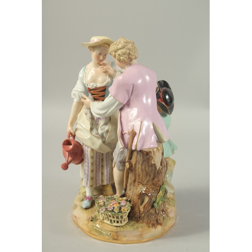 1067 - A LARGE MEISSEN GROUP OF GARDENERS with a child at the back, first modelled by Victor Acier, Cross s... 