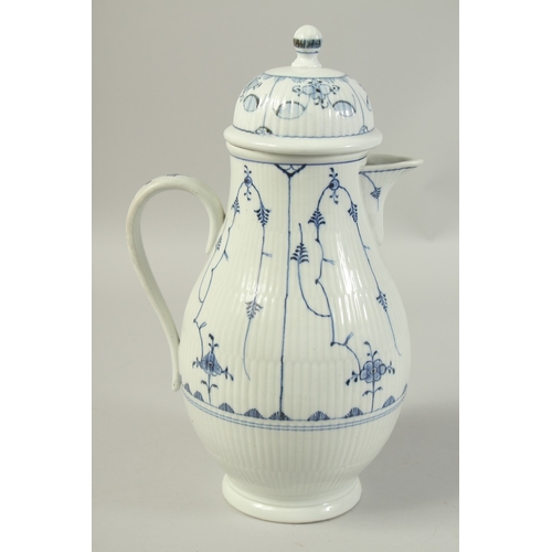 1068 - A LARGE VOLKSTEDT COFFEE POT decorated with a stylised flower decoration in under glaze blue. Circa.... 