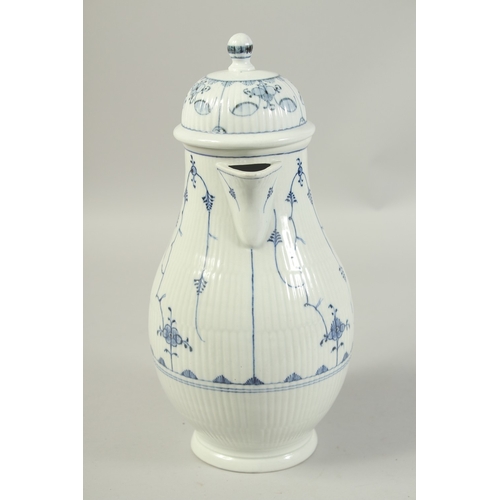 1068 - A LARGE VOLKSTEDT COFFEE POT decorated with a stylised flower decoration in under glaze blue. Circa.... 