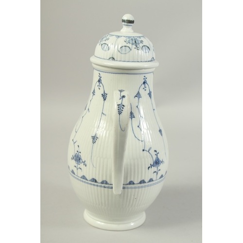 1068 - A LARGE VOLKSTEDT COFFEE POT decorated with a stylised flower decoration in under glaze blue. Circa.... 