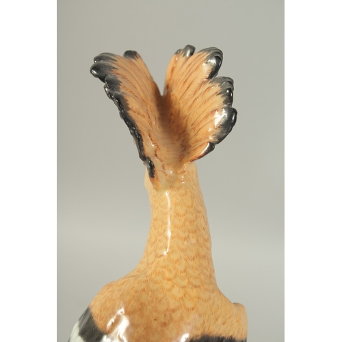 1076A - A MEISSEN HOOPOE, first modelled by Joachim Kaendler. Circa. 1840.  31.2cm high. Cross sword mark in... 