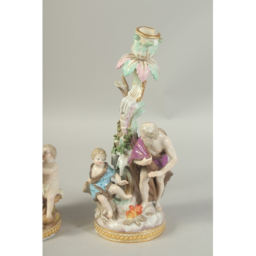 1076 - A PAIR OF MEISSEN CANDLESTICKS depicting winter and spring. 29cm high.  Cross swords mark in blue.... 