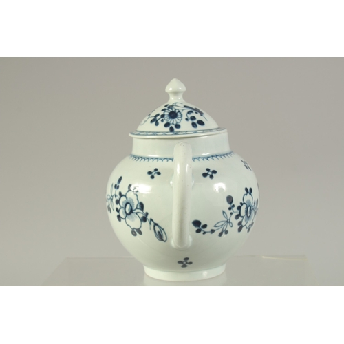 1092 - A LIVERPOOL PORCELAIN GLOBULAR TEAPOT AND COVER, painted with flowers in under glazed blue.