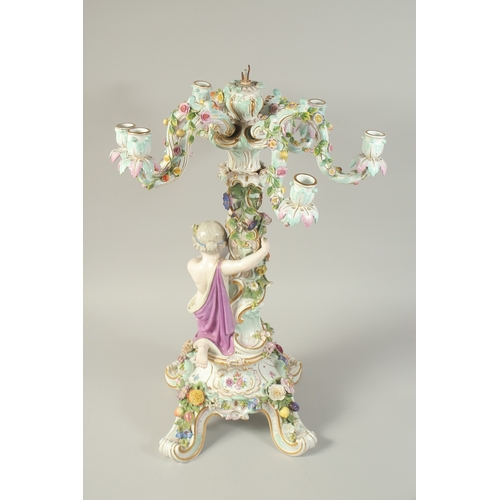 1131 - A SUPERB MEISSEN PORCELAIN CANDELABRA MUDEL VON ERNST, AUGUST LEUTERITZ.1862 -1885. The stem with a ... 