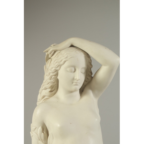 1137 - A MARSHALL AND WOOD COPELAND PARIAN FIGURE OF DAPHNE, standing naked on a circular base. 23ins high.... 