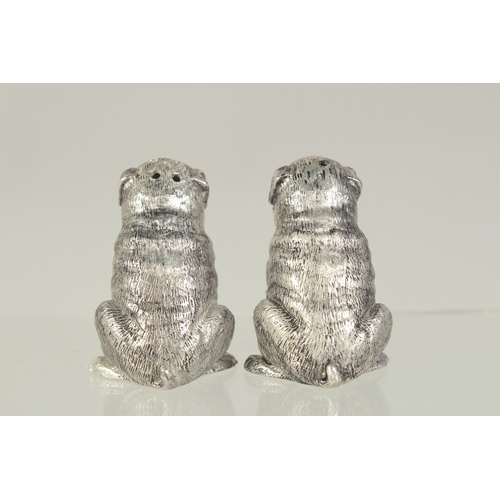 1462 - A PAIR OF SILVER PLATED DOG SALT AND PEPPERS. 1.75ins.