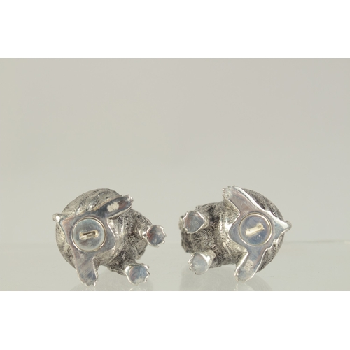 1462 - A PAIR OF SILVER PLATED DOG SALT AND PEPPERS. 1.75ins.