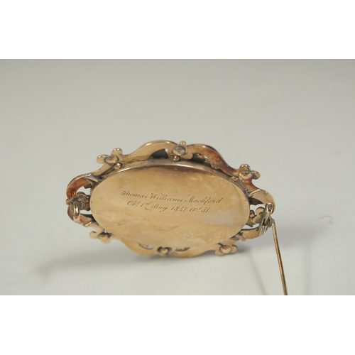 1482 - A VICTORIAN BROOCH inset with hair and seed pearls. Inscribed and dated ,1847.