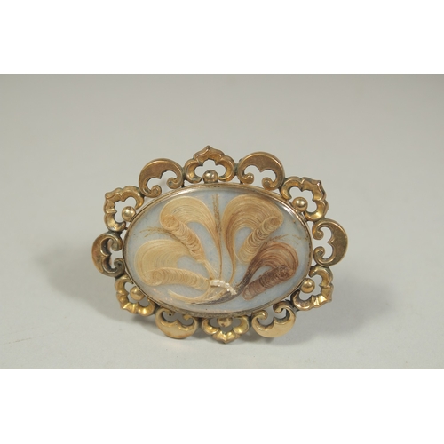 1483 - A VICTORIAN BROOCH inset with hair and seed pearls. Inscribed and dated ,1843.