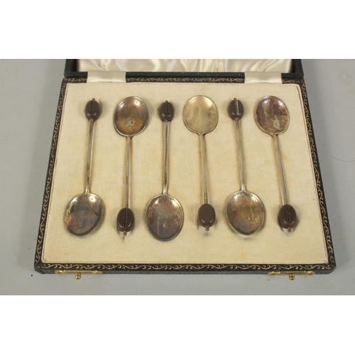 1792 - A SET OF SIX BEAN END COFFEE SPOONS with enamel bowls, cased.