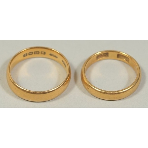 1480 - TWO 22CT GOLD WEDDING BANDS. Weight: 9gms.