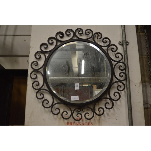 101 - A circular wrought iron framed mirror.