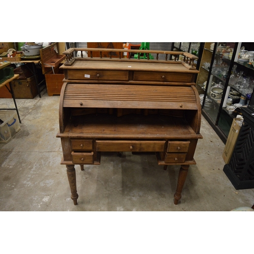 151 - A reproduction roll-top desk.