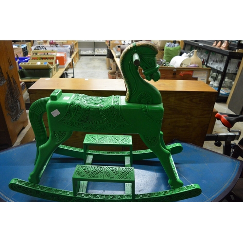 159 - A green painted carved wood rocking horse.