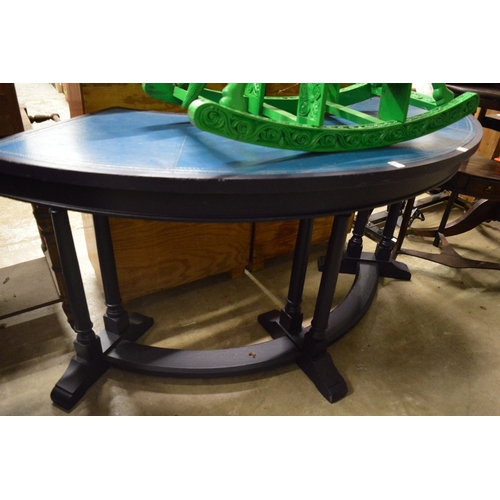 160 - A blue leather cloth inset demi-lune oak serving table.