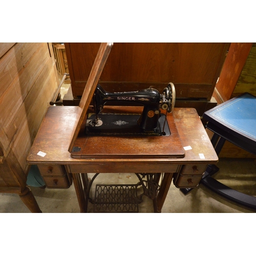 161 - A Singer treadle operated sewing machine.