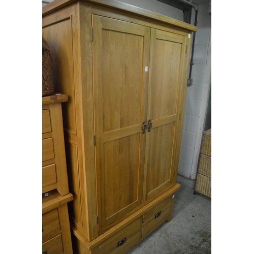 182 - Modern light oak wardrobe together with a matching dressing table, stool and three drawer chest.