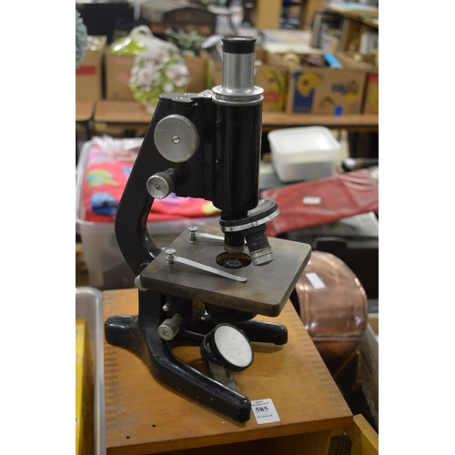 A boxed microscope.