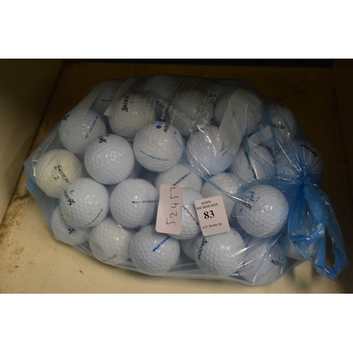 83 - A bag of fifty Srixon golf balls.