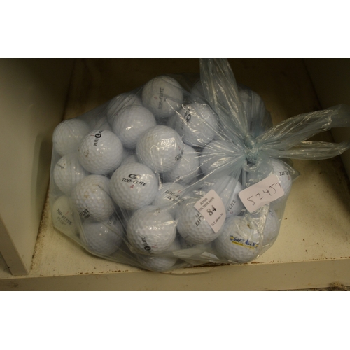 84 - A bag of fifty Top Flite golf balls.