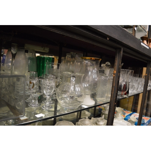 98 - A large quantity of glassware to include numerous vases, drinking glasses etc.