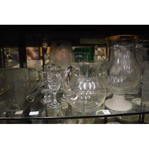 98 - A large quantity of glassware to include numerous vases, drinking glasses etc.