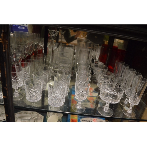 98 - A large quantity of glassware to include numerous vases, drinking glasses etc.