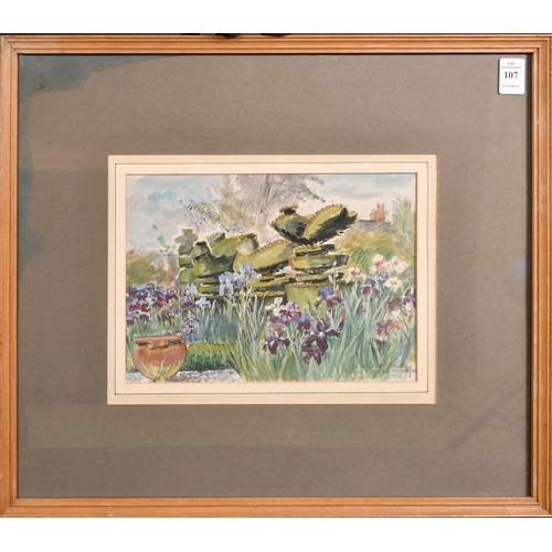 107 - Hermione Hammond (1910-2005), an iris fringed pond and topiary in a garden, watercolour, signed and ... 