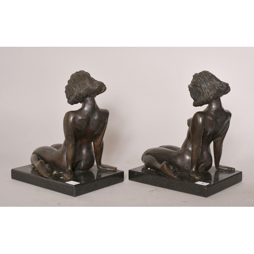 189 - David Mackay-Harrison (b. 1941), Australian, a pair of book ends, of  kneeling female nudes, each on... 