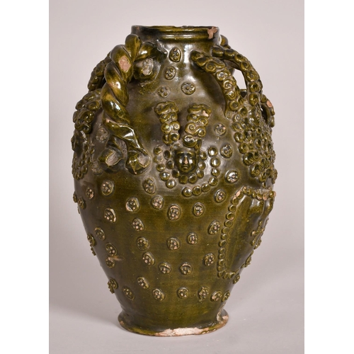 193 - Early 15th Century, a ceramic medieval vessel, scrolling handles and applied decoration, 14.5